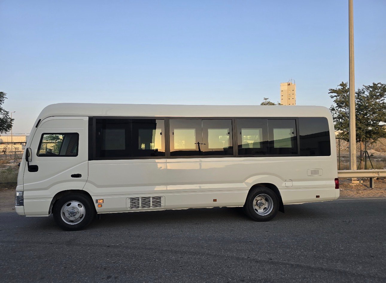 2025 Toyota Coaster bus Bus — Rear 3/4